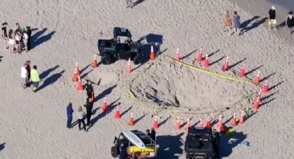 Muere niña en playa de Florida; quedó enterrada en hoyo de arena donde jugaba