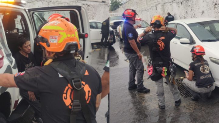 Mujer es arrastrada por la corriente y cae a alcantarilla de Santa Catarina; la rescatan con vida